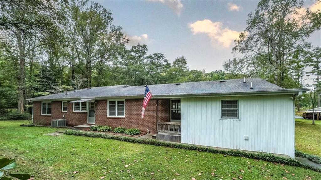 7146 Old Beulah Road Lithia Springs, GA 30122 - Photo 38 of 45 a view of a house with a yard