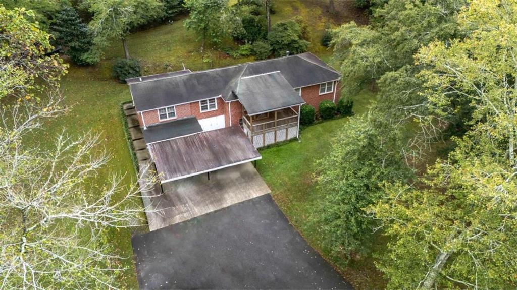 7146 Old Beulah Road Lithia Springs, GA 30122 - Photo 40 of 45 an aerial view of a house with a garden and lake view