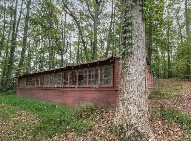 a view of house with backyard