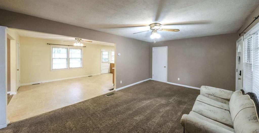 7146 Old Beulah Road Lithia Springs, GA 30122 - Photo 7 of 45 an empty room with windows and fan