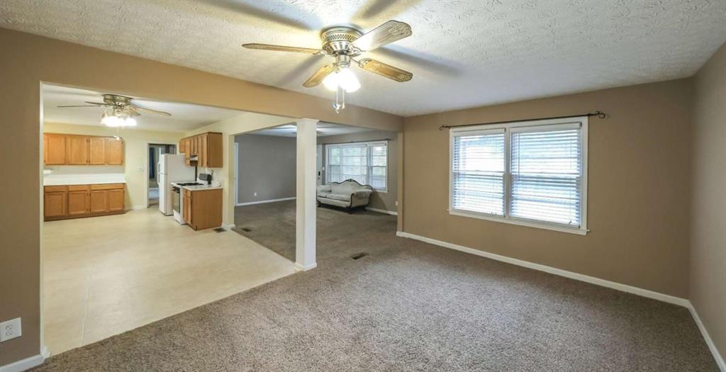 7146 Old Beulah Road Lithia Springs, GA 30122 - Photo 9 of 45 a view of an empty room with a window