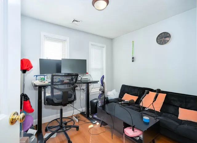 a workspace with furniture and screen