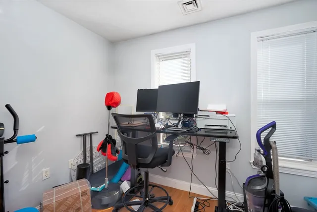 a view of a workspace with furniture