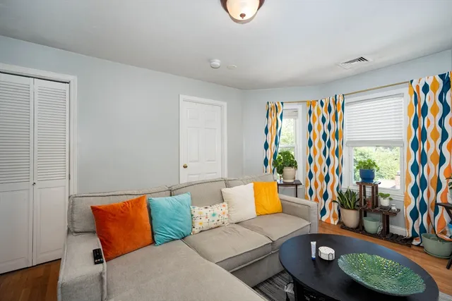 a living room with furniture and a rug