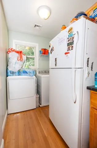 a white refrigerator freezer sitting in a kitchen