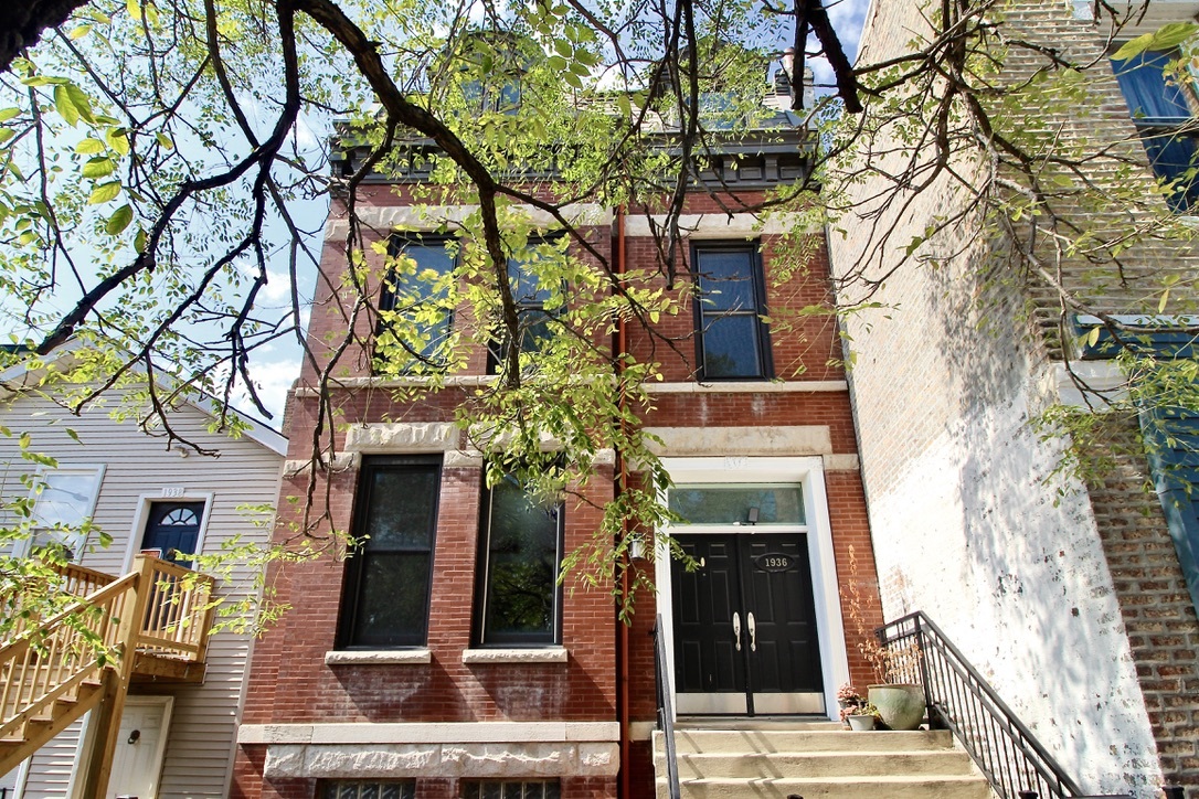 1936 South Racine Avenue Chicago, IL 60608 - Photo 1 of 48 front view of a building with a tree