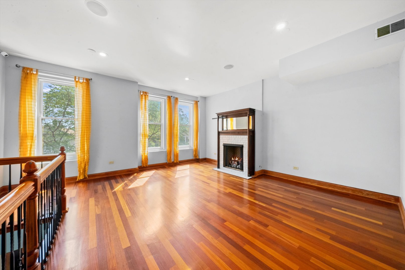 1936 South Racine Avenue Chicago, IL 60608 - Photo 16 of 48 a view of an empty room with wooden floor and a window