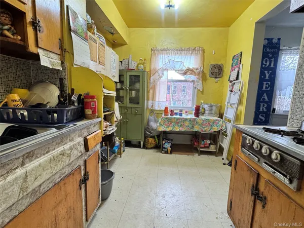 a kitchen filled with a stove and a sink