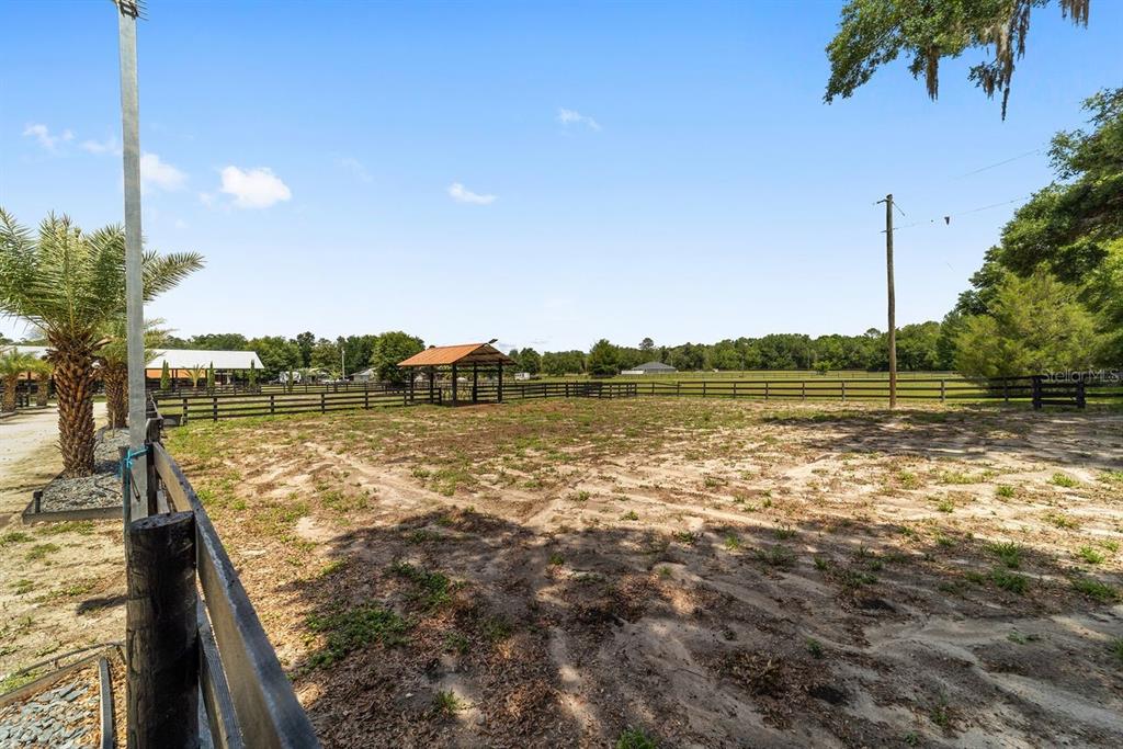 16392 Northeast Jacksonville Road Citra, FL 32113 - Photo 35 of 44 a view of a lake with a yard