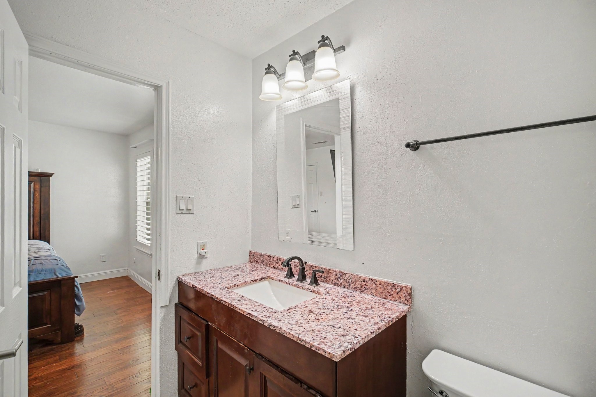 5801 Lumberdale Road, Unit 78 Houston, TX 77092 - Photo 22 of 35 Experience modern elegance in this updated bath, featuring a chic vanity with a granite countertop and contemporary fixtures.
