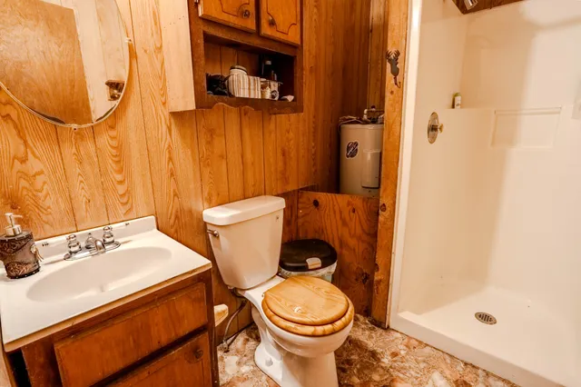 a white toilet sitting next to a bathroom sink