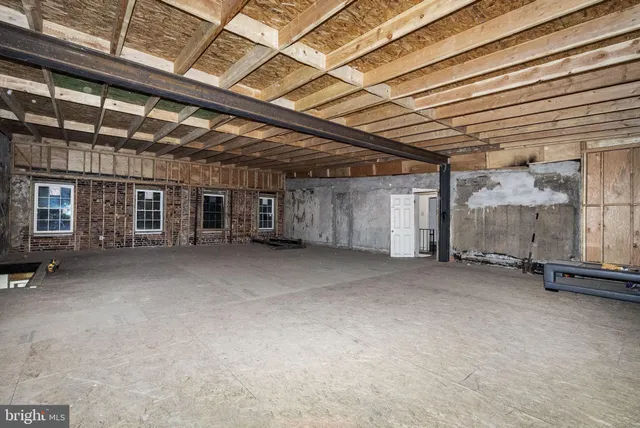 a view of a room with wooden walls