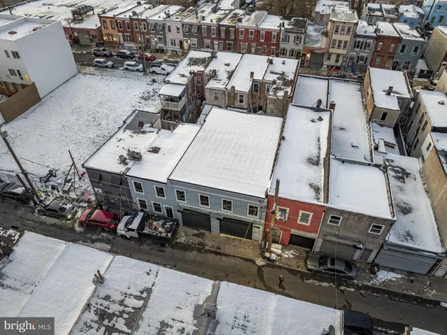 an aerial view of a house with roof deck