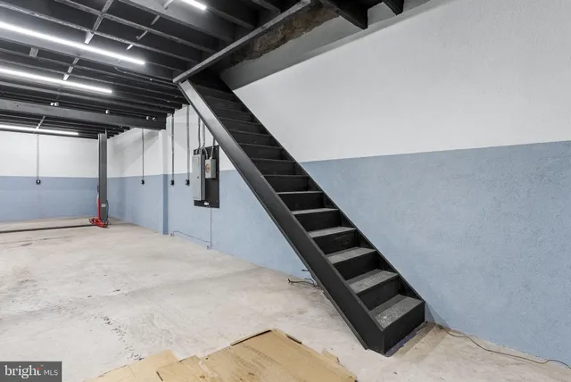 a view of an empty room with stairs