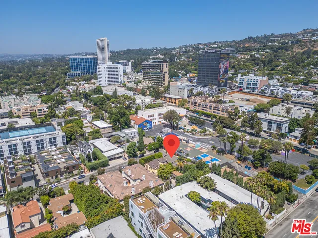 an aerial view of a house and a yard