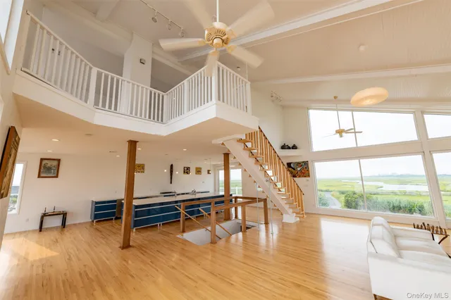 a view of an entryway with wooden floor