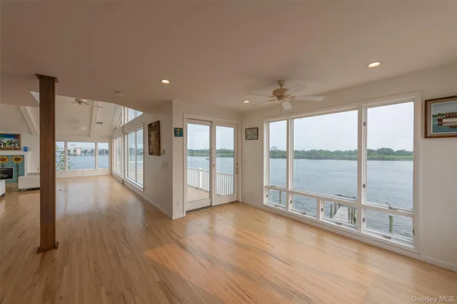 a view of an entryway with wooden floor