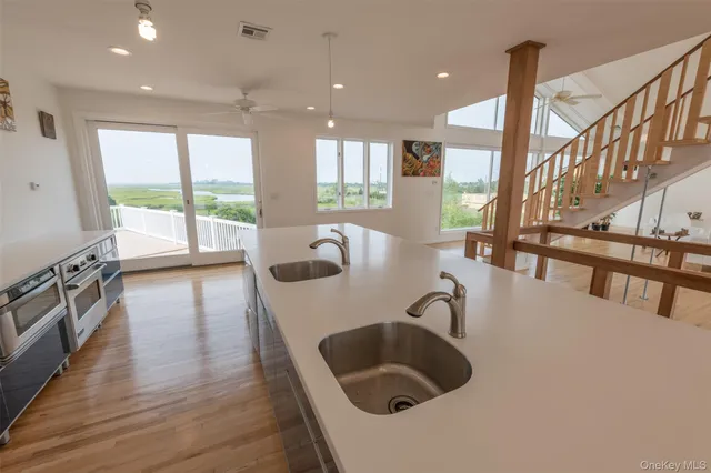 a kitchen with sink and window