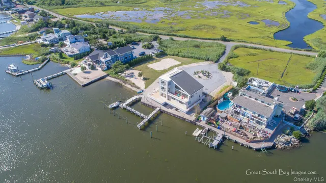 an aerial view of a house with a ocean view