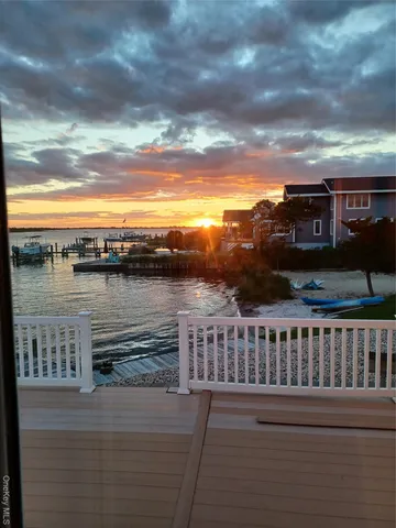 a view of a lake from a balcony