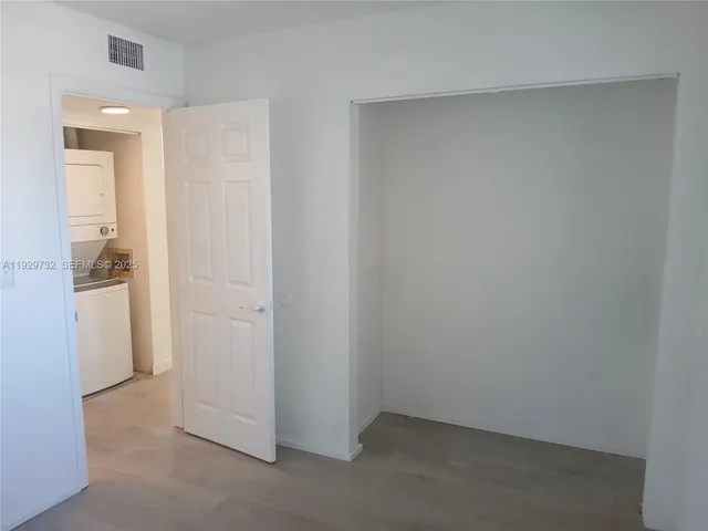 an empty room with shelves