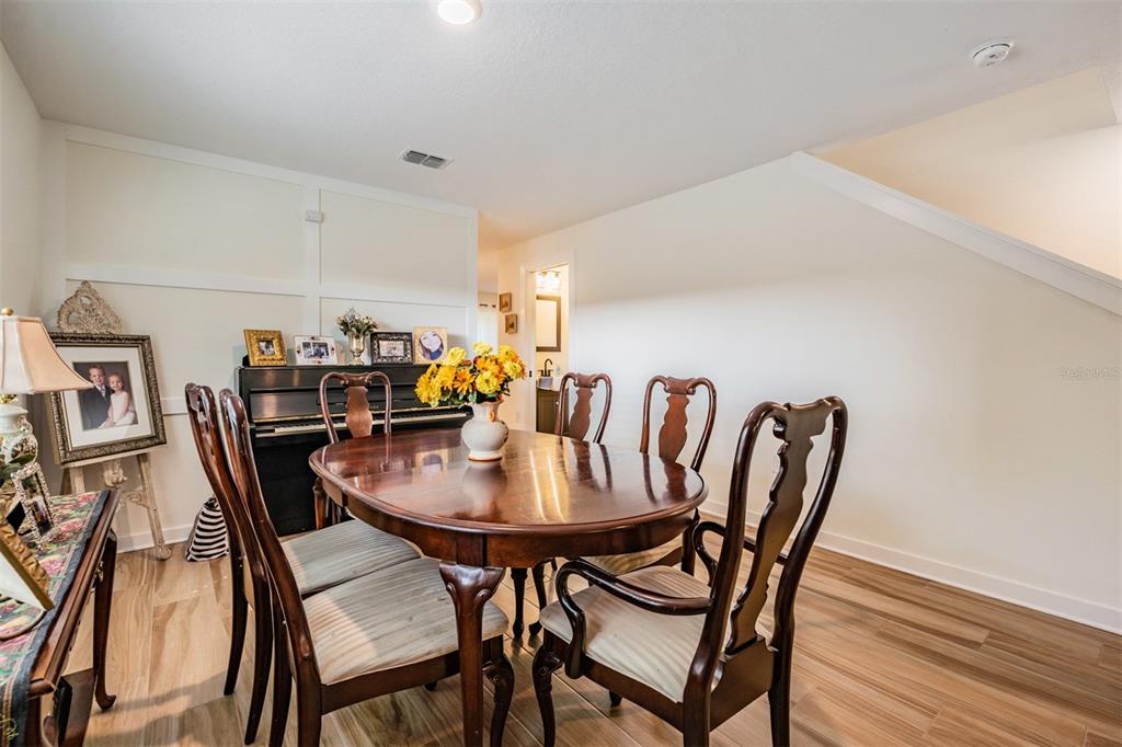 17415 Sweetwater Road Dade City, FL 33523 - Photo 21 of 72 a view of a dining room with furniture