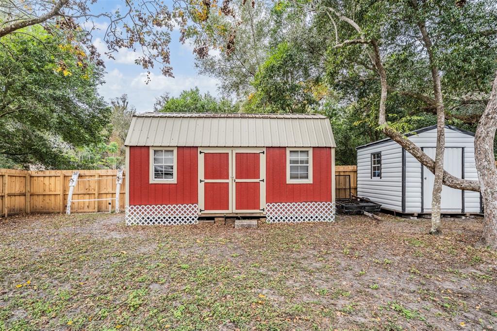 17415 Sweetwater Road Dade City, FL 33523 - Photo 45 of 72 a front view of a house with a yard