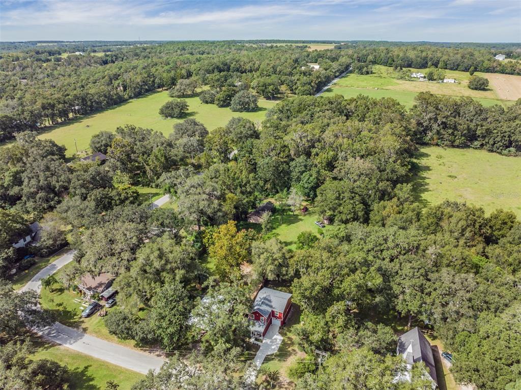 17415 Sweetwater Road Dade City, FL 33523 - Photo 51 of 72 a view of a lake with a mountain in the background