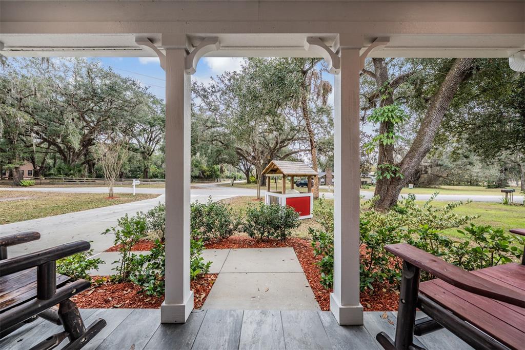 17415 Sweetwater Road Dade City, FL 33523 - Photo 7 of 72 a view of a porch with wooden floor