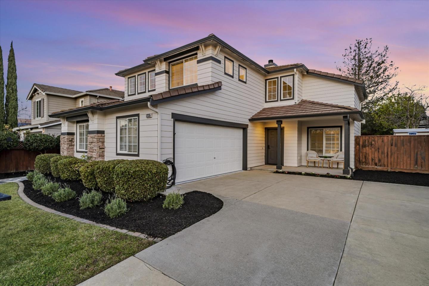 1235 Echo Summit Street Livermore, CA 94551 - Photo 1 of 1 a front view of a house with a yard and garage