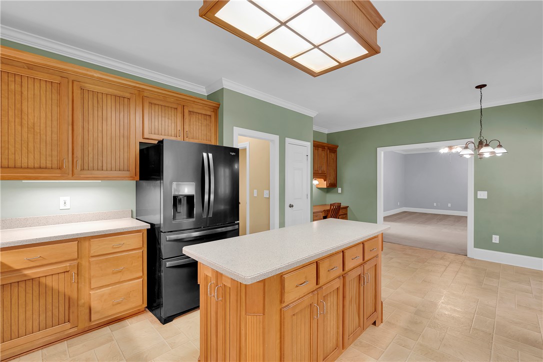 406 Hopewell Ridge Anderson, SC 29621 - Photo 11 of 46 This spacious kitchen with warm wood cabinetry and a central island is perfect for culinary endeavors.