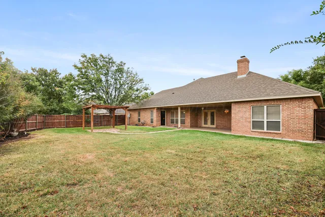 a house with trees in front of it