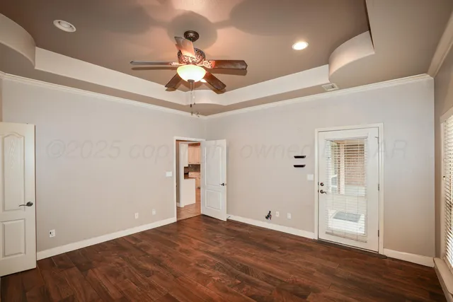 a view of an empty room and wooden floor