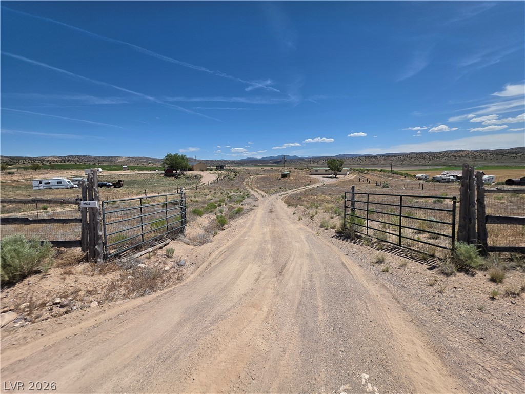 2930 Frehner Ranch Road Pioche, NV 89043 - Photo 4 of 39 Enter through rustic gates onto a winding dirt road leading to expansive acreage.