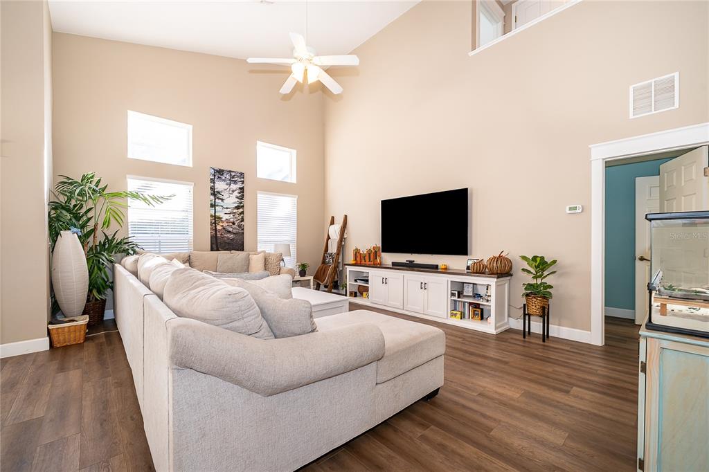 758 Seneca Meadows Road Winter Springs, FL 32708 - Photo 11 of 37 a living room with furniture and a flat screen tv