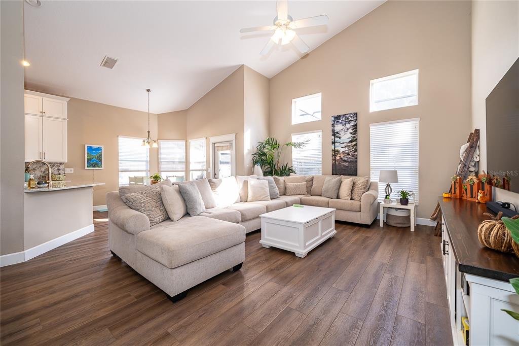758 Seneca Meadows Road Winter Springs, FL 32708 - Photo 12 of 37 a living room with furniture and a large window