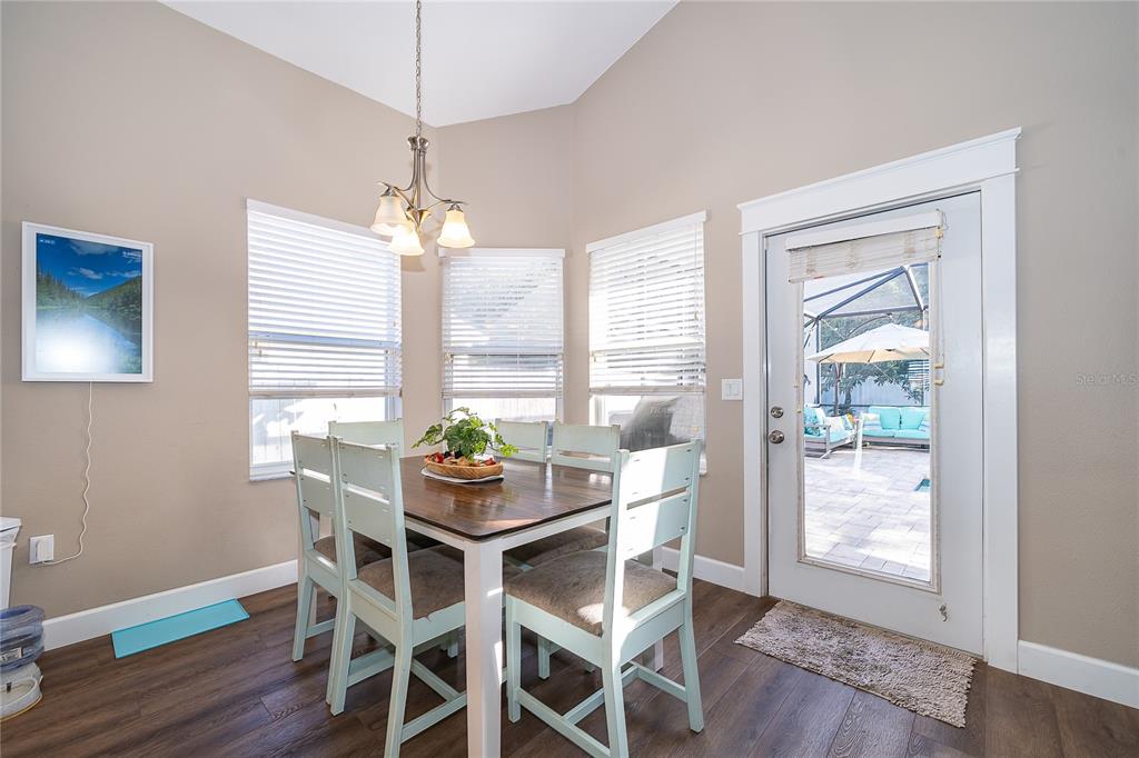 758 Seneca Meadows Road Winter Springs, FL 32708 - Photo 17 of 37 a dining room with furniture window wooden floor