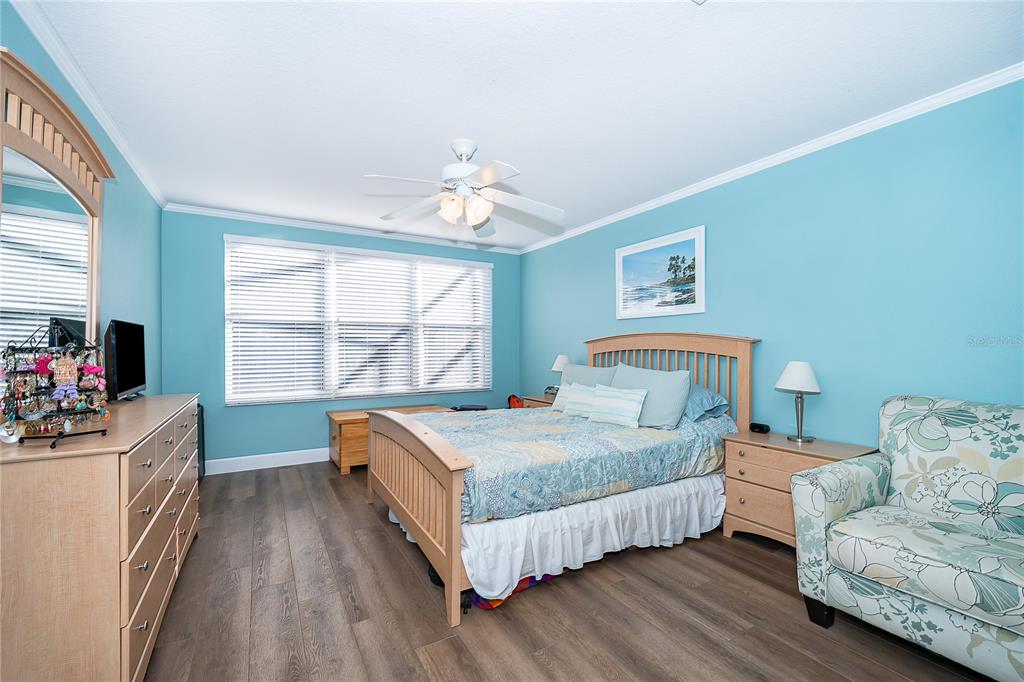 758 Seneca Meadows Road Winter Springs, FL 32708 - Photo 19 of 37 a bedroom with a bed and a large window