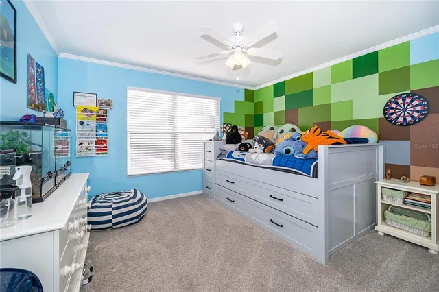 a bedroom with furniture and a window