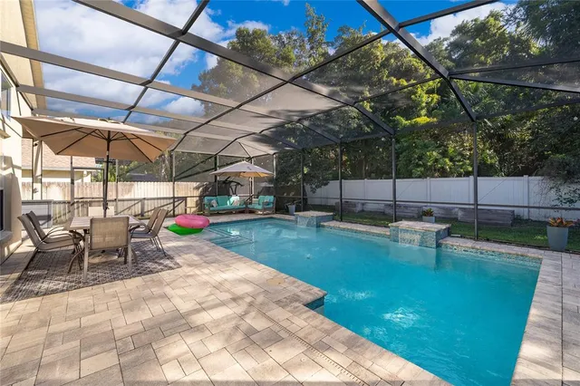 a view of a backyard with sitting area