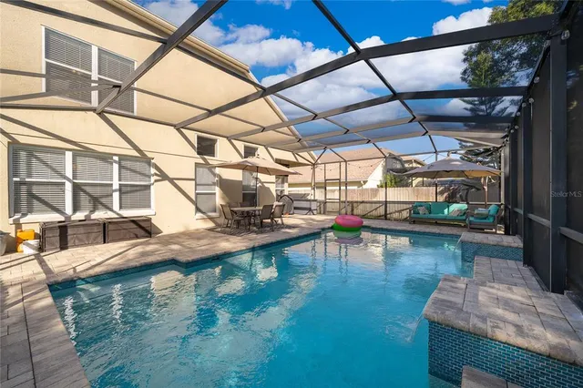 a view of a swimming pool with a patio
