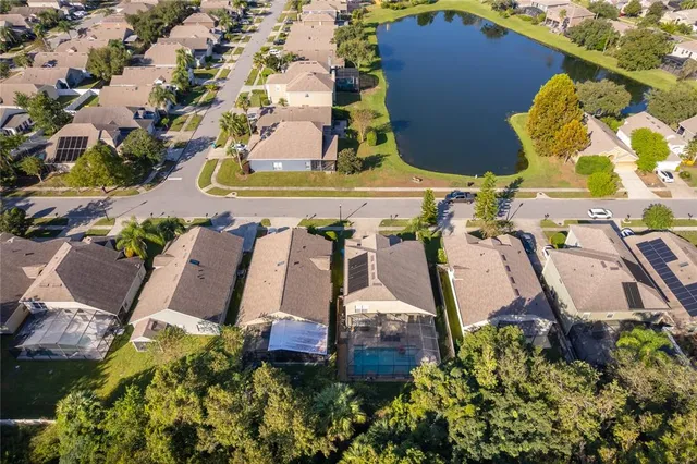 an aerial view of multiple houses with yard