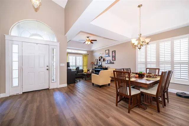 a view of a dining room with furniture window and wooden floor