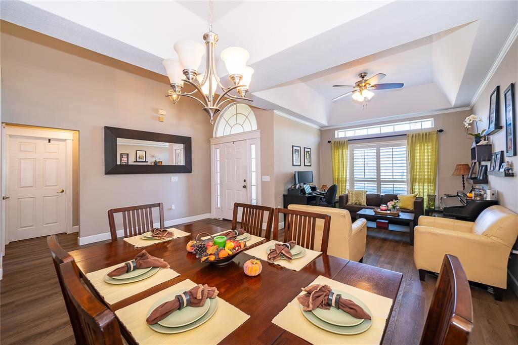 758 Seneca Meadows Road Winter Springs, FL 32708 - Photo 8 of 37 a living room with couches a dining table and chairs with wooden floor