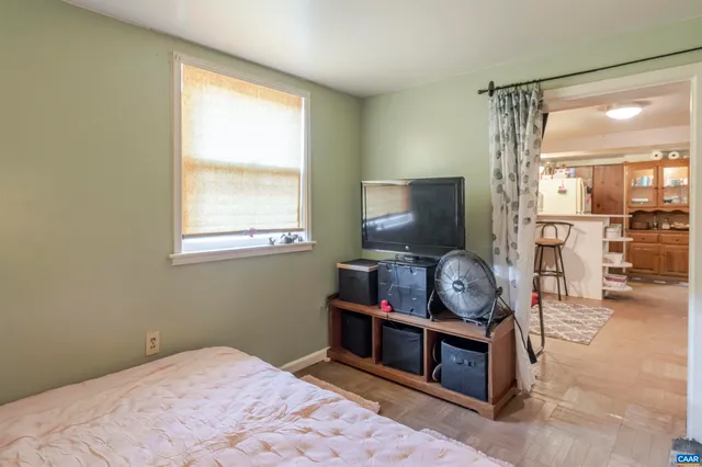 a living room with furniture and flat screen tv