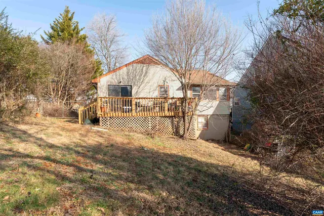 a view of backyard with large trees