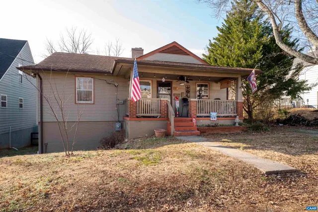 a view of a house with wooden fence