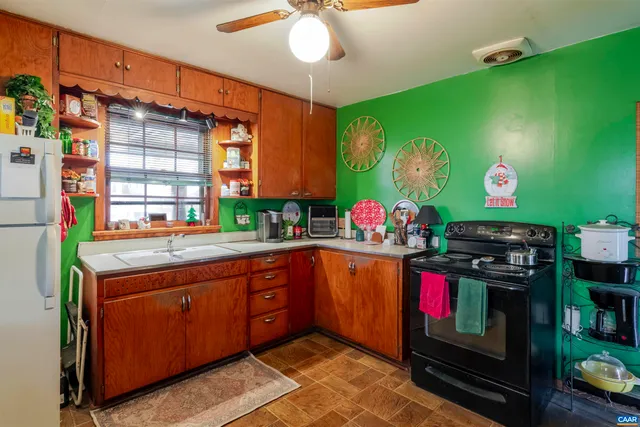 a kitchen with stainless steel appliances granite countertop a stove and a sink
