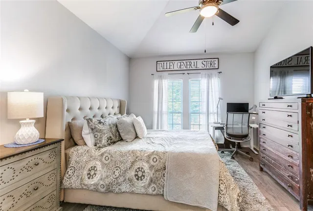 a bedroom with a large bed and window