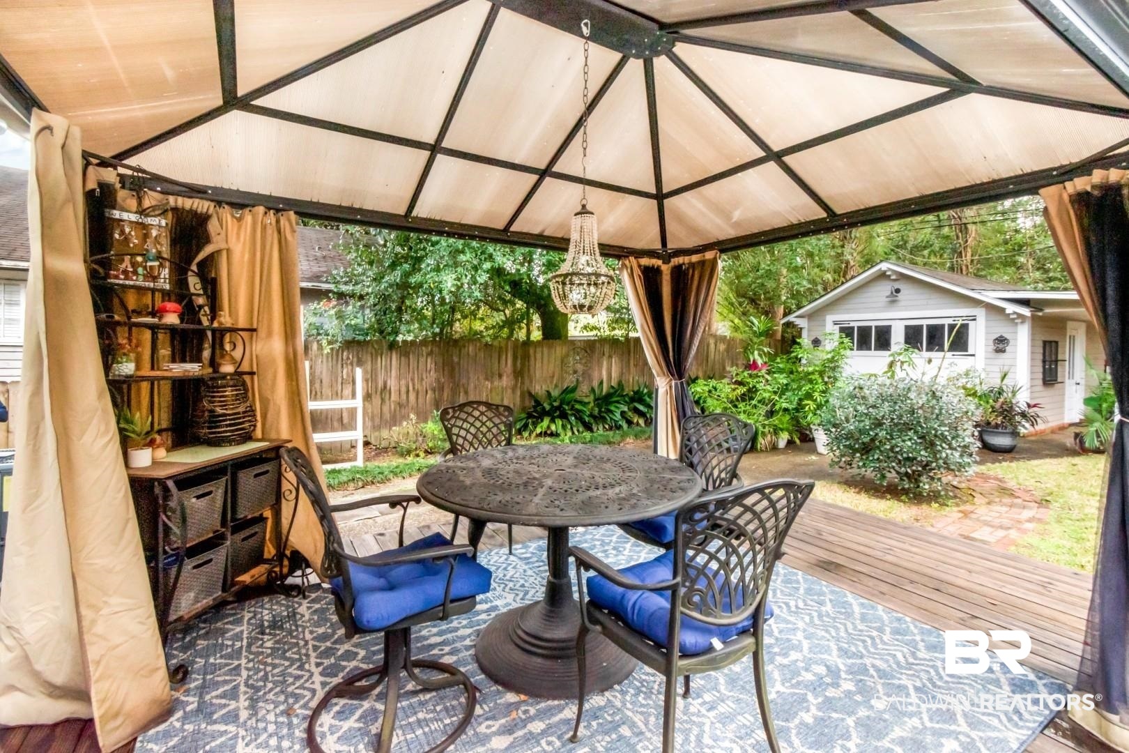 135 Silverwood Street Mobile, AL 36607 - Photo 23 of 32 View of patio / terrace with outdoor dining space, a gazebo, an outbuilding, and a deck
